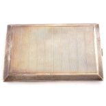 George V silver cigarette case of rectangular form, engine turned decoration, side full length