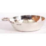 Elizabeth II solid silver wine taster, the round bowl applied with a coiled snake loop handle, 9cm