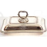 George V hallmarked small silver entree dish and lid of rectangular shape, applied gadrooned