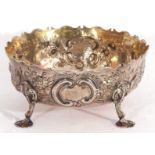 Victorian silver sugar bowl, circular form, of George II design, embossed and chased with flowers