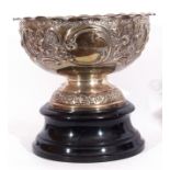 Late Victorian silver rose bowl raised on a pedestal foot and having an all over chased leaf and