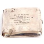 George V silver cigarette case of shaped rectangular form, engraved "E Claxton, Captain of