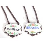 Small pair of Elizabeth II hallmarked silver and enamelled spirit labels of cartouche form, "Brandy"