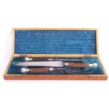 Cast Victorian three piece cased carving set with stag antler handles, silver mounts marked to