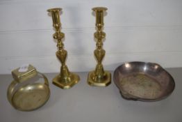 TWO BRASS CANDLESTICKS AND TWO METAL DISHES