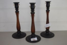 THREE WOODEN CANDLESTICKS WITH METAL SCONCES