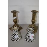 TWO POTTERY CANDLESTICKS AND TWO BRASS CANDLESTICKS