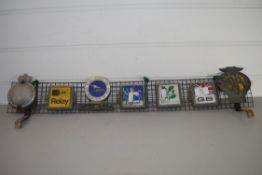 CAR BADGES MOUNTED ON METAL GRILLE INCLUDING AA, RSPB, NT ETC