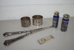 SMALL PLASTIC BAG CONTAINING SILVER METAL TONGS, TWO NAPKIN RINGS ETC