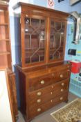 Mahogany secretaire bookcase with astragal glazed cabinet raised above fully fitted secretaire