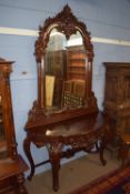 Heavily carved mahogany hall stand, probably Colonial, circa late 19th century, with mirrored back