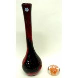 Murano paperweight with orange swirling design and a large Murano baluster vase with a red and black