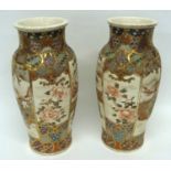 Large pair of Satsuma vases decorated in typical fashion with Japanese dignitaries within a