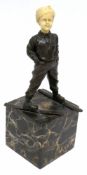 Reproduction Art Deco figure of a skier on onyx or marble base, the head modelled in resin, 30cm