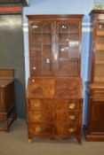 Late Georgian mahogany bureau bookcase, the top section with concave sided cornice above two glass