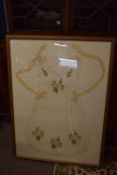 Framed 19th century maid's apron, the silk embroidered with flowers, in wooden frame