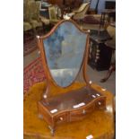 Edwardian shield-shaped toilet mirror raised on a serpentine three drawer base with ivory