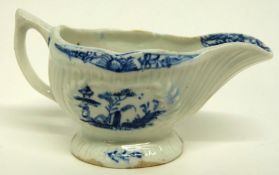 Small Lowestoft porcelain cream boat, the fluted sides decorated in underglaze blue with fishermen
