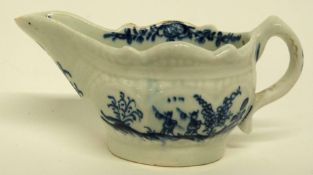 Small Lowestoft porcelain cream boat decorated in blue and white with a version of the two porter