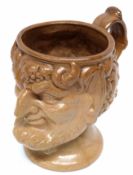 19th century stoneware model of Bacchus with scroll handle, 16cm high