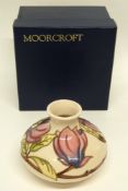 Modern Moorcroft vase with original box, the vase with a tube lined floral design on white ground
