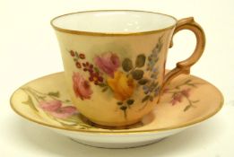 Miniature blush ground Royal Worcester cup and saucer, the blush ground decorated with flowers