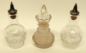 Two cut glass vinegar or oil bottles together with a further hobnail cut glass jar with stopper (3)