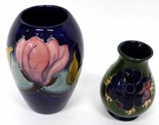 Moorcroft vase, floral design on blue ground, and further small vase with tube lined floral design