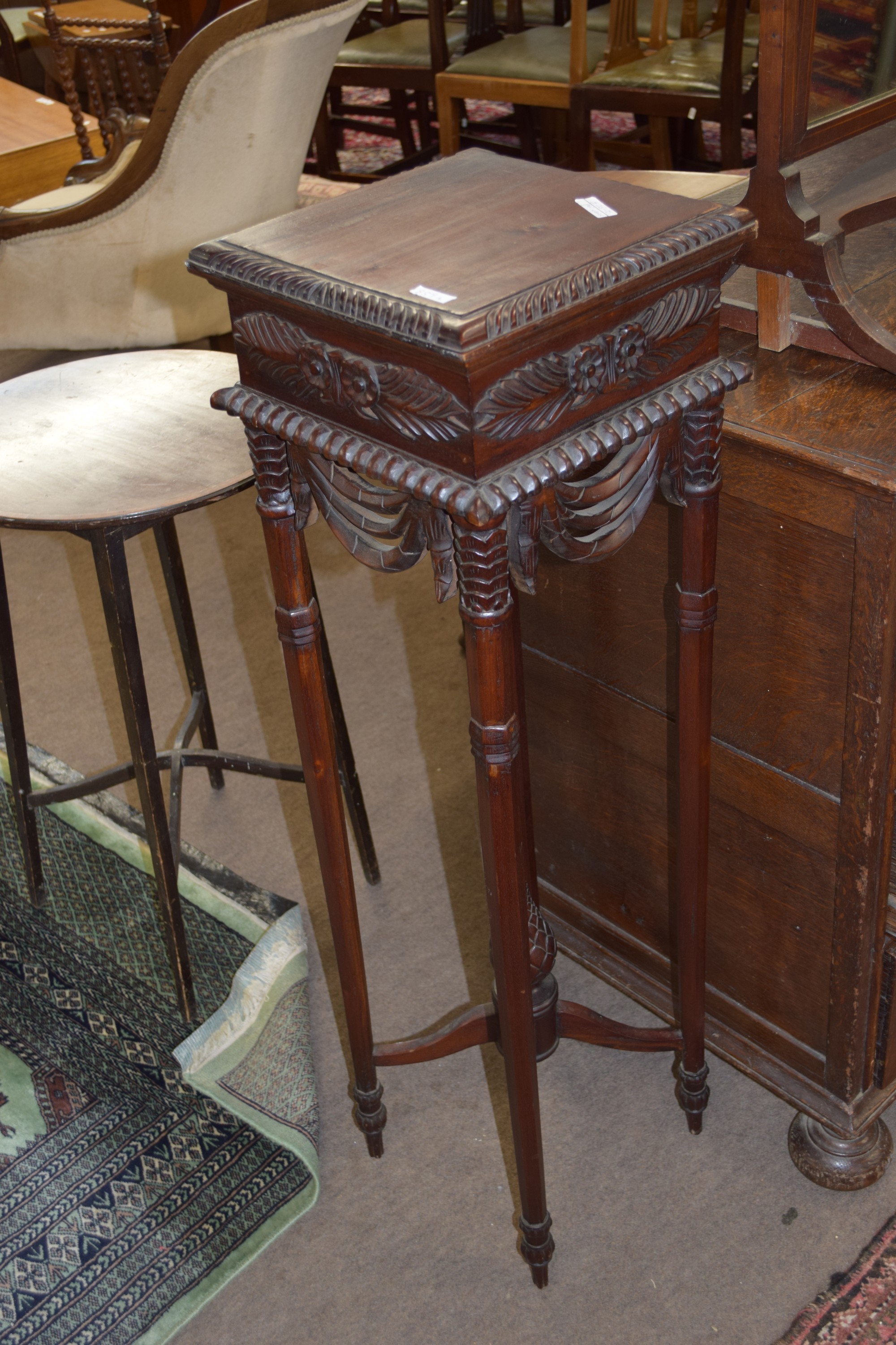 Late 19th century Anglo-Indian hardwood torchere or plant stand, raised on octagonal legs with