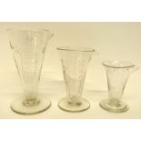 Group of 19th century glass measuring jugs with calibrated and engraved markings, probably