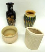 Group of four pottery vases of various shapes and designs