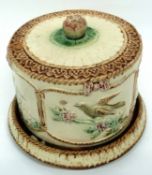 19th century cheese dish and cover with majolica type glazes and bird decoration