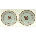 Two late 18th century Chinese export porcelain plates decorated in famille rose with floral designs,