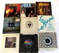 A small suitcase of mainly rock albums and singles to include Deep Purple, Eric Clapton, Bob