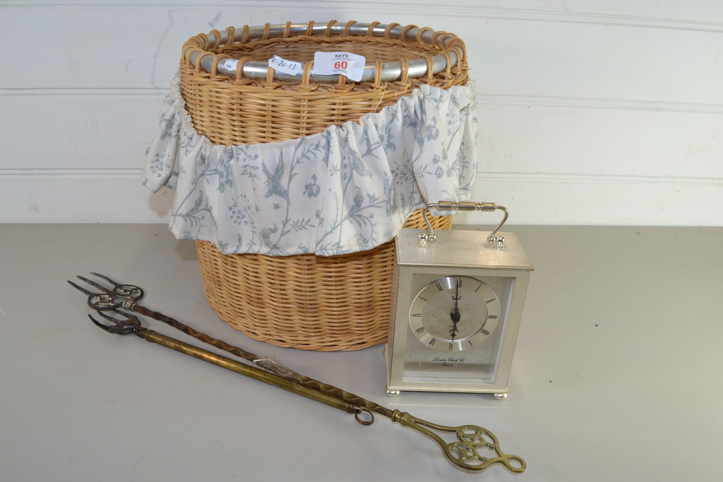 WICKER BASKET CONTAINING A CARRIAGE CLOCK