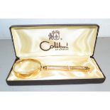 GOLD COLOURED MAGNIFYING GLASS BY COLIBRI, IN ORIGINAL BOX