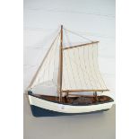 SMALL WOODEN ROWING BOAT WITH SAIL