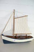 SMALL WOODEN ROWING BOAT WITH SAIL