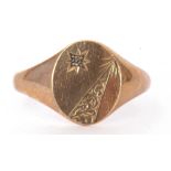 9ct gold and diamond gents signet ring, the oval panel highlighted with a small diamond in a star