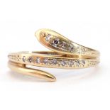Modern 9ct gold and diamond serpent ring, a design of a coiled snake highlighted with small