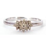 Modern 9ct white gold and diamond cluster ring, the diamond cluster with small single cut