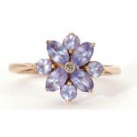 Modern 9ct pale purple stone and small diamond cluster ring, stamped 9K, size O