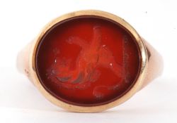 Antique lion carnelian intaglio gold signet ring, the carnelian engraved with a rampant lion