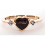 Modern 9ct gold and diamond heartstone ring, the centre heart shaped coloured stone is bezel set and