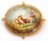 Antique hand painted porcelain brooch, the oval panel decorated with a pair of golden pheasants in a