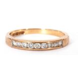 9ct gold diamond half hoop ring featuring nine round channel set small brilliant cut diamonds,