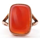 9ct stamped carnelian dress ring, the rectangular cut carnelian 18 x 12mm, bezel set and raised