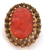 Antique carved coral oval cameo brooch depicting a profile of a gentleman, 24 x 18mm, framed in a