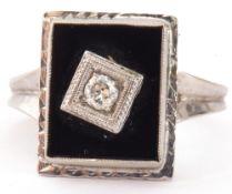 Art Deco style diamond and onyx ring, the rectangular shaped onyx panel 12 x 8mm, centrally set with