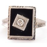 Art Deco style diamond and onyx ring, the rectangular shaped onyx panel 12 x 8mm, centrally set with